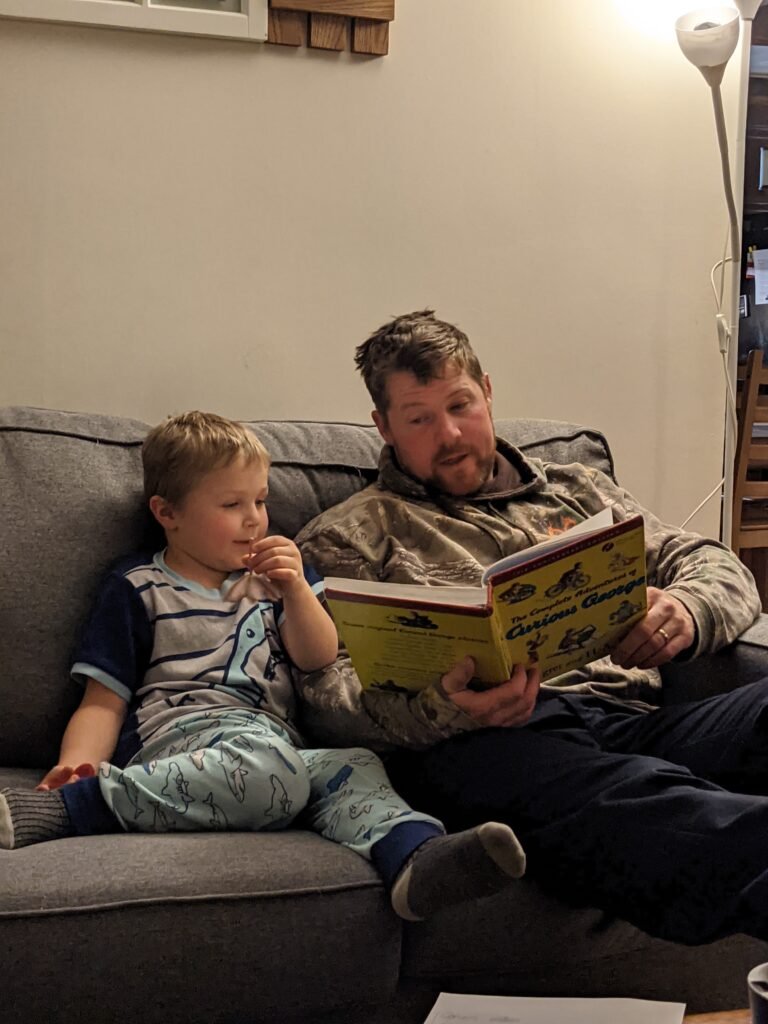 parent reading with child to encourage deeper connection than screens