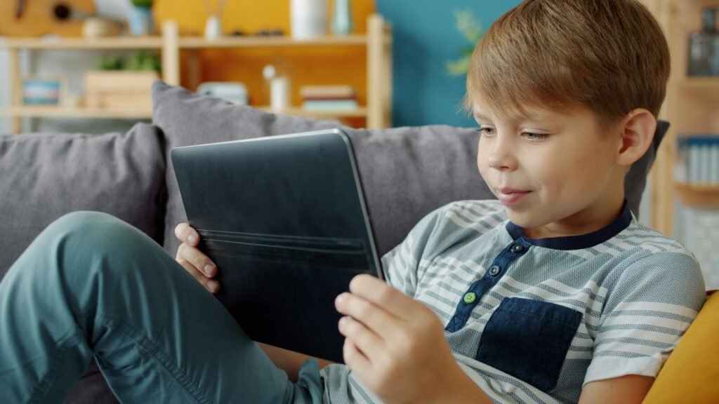 child using a tablet representing screen time challenges for families